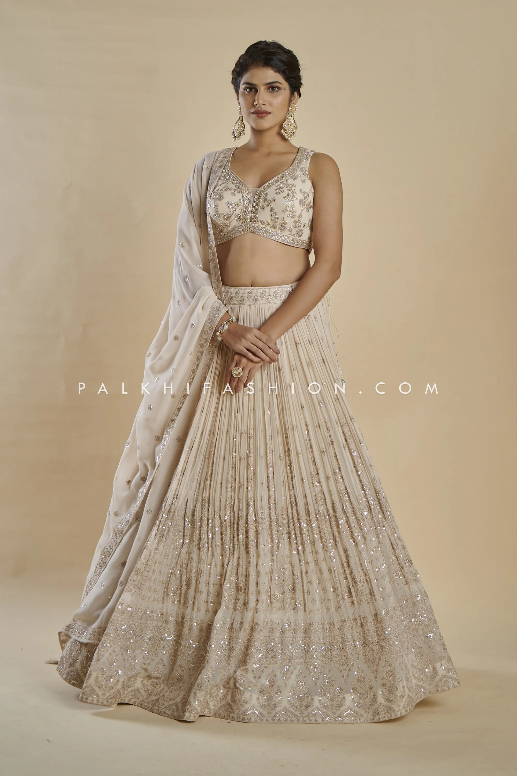 Imperial Charm: Exclusive Champagne Lehenga Choli with Handwork